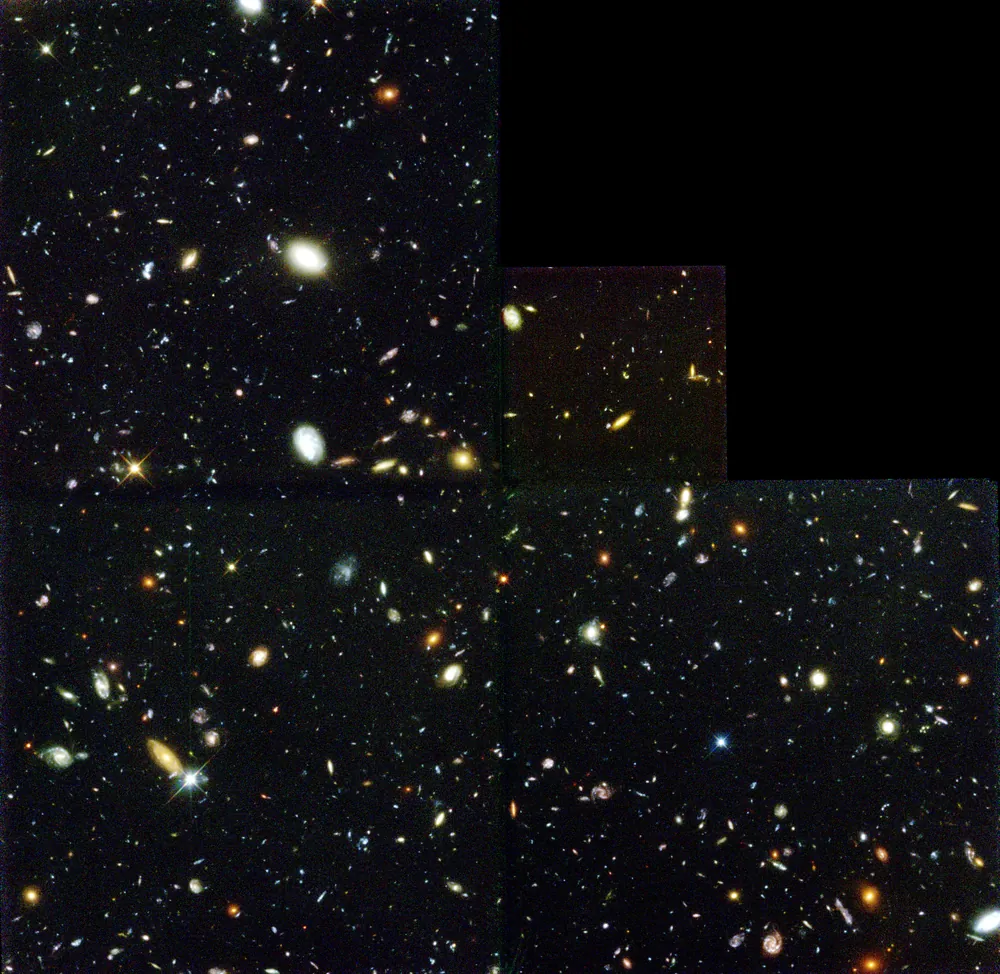 The full Hubble Deep Field, a stair-step shaped mosaic crowded with galaxies of many sizes and colors
