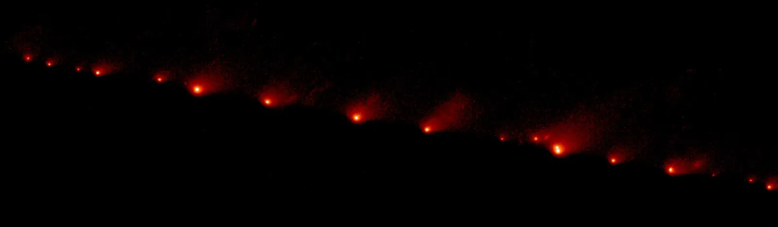 The fragments of Comet Shoemaker-Levy 9 strung out in a diagonal line, imaged by Hubble